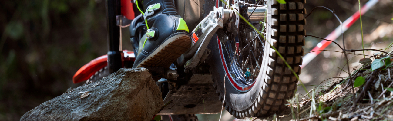 close up of man o nbike and his tires