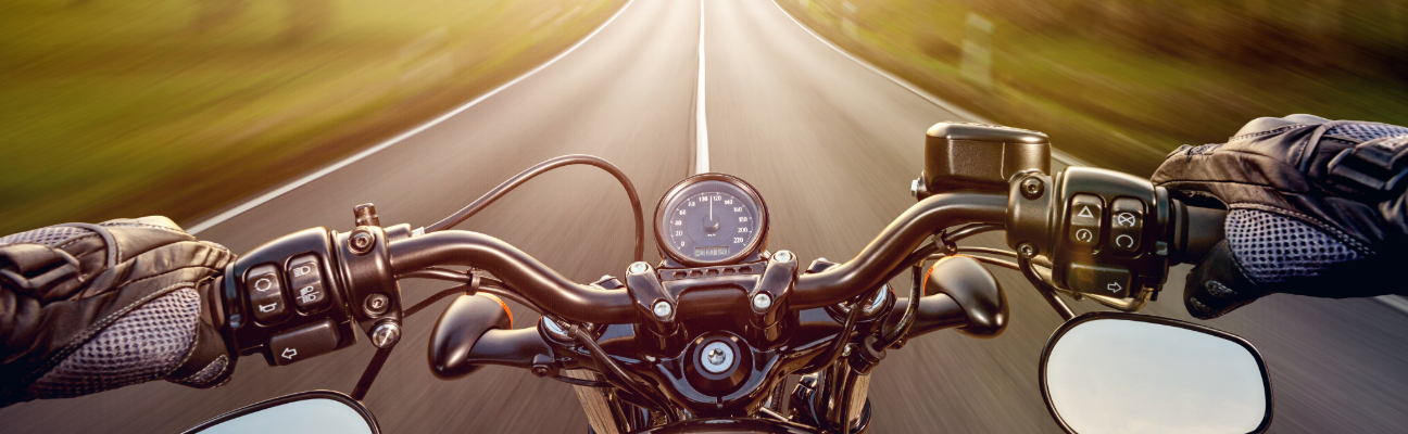 Motorcyclist driving down road