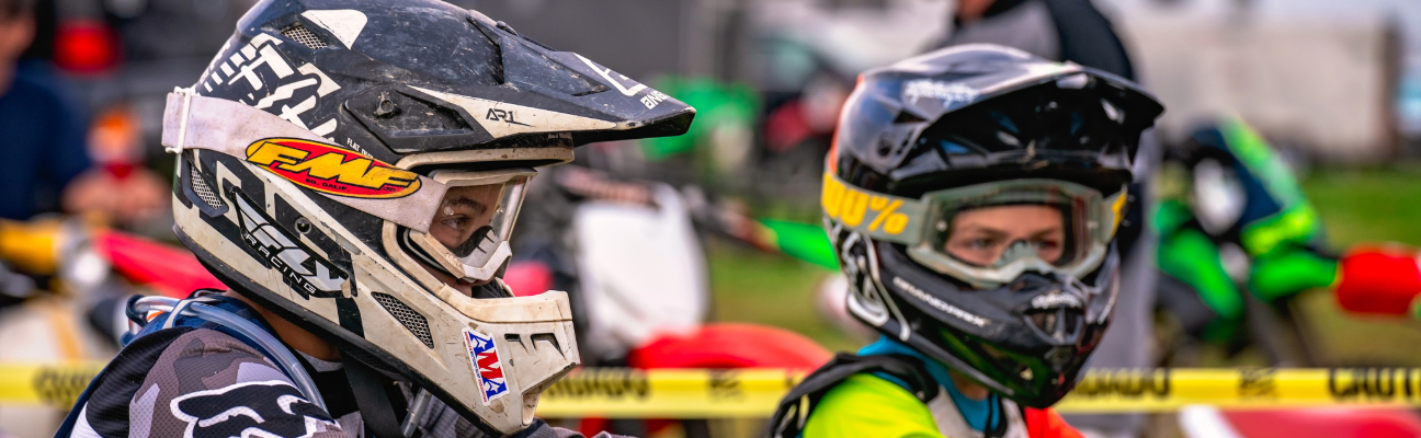 Side profile of two young riders