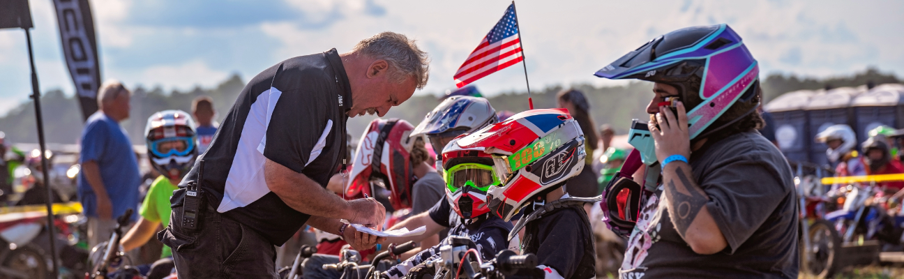 Kids lining up to race dirt bikes